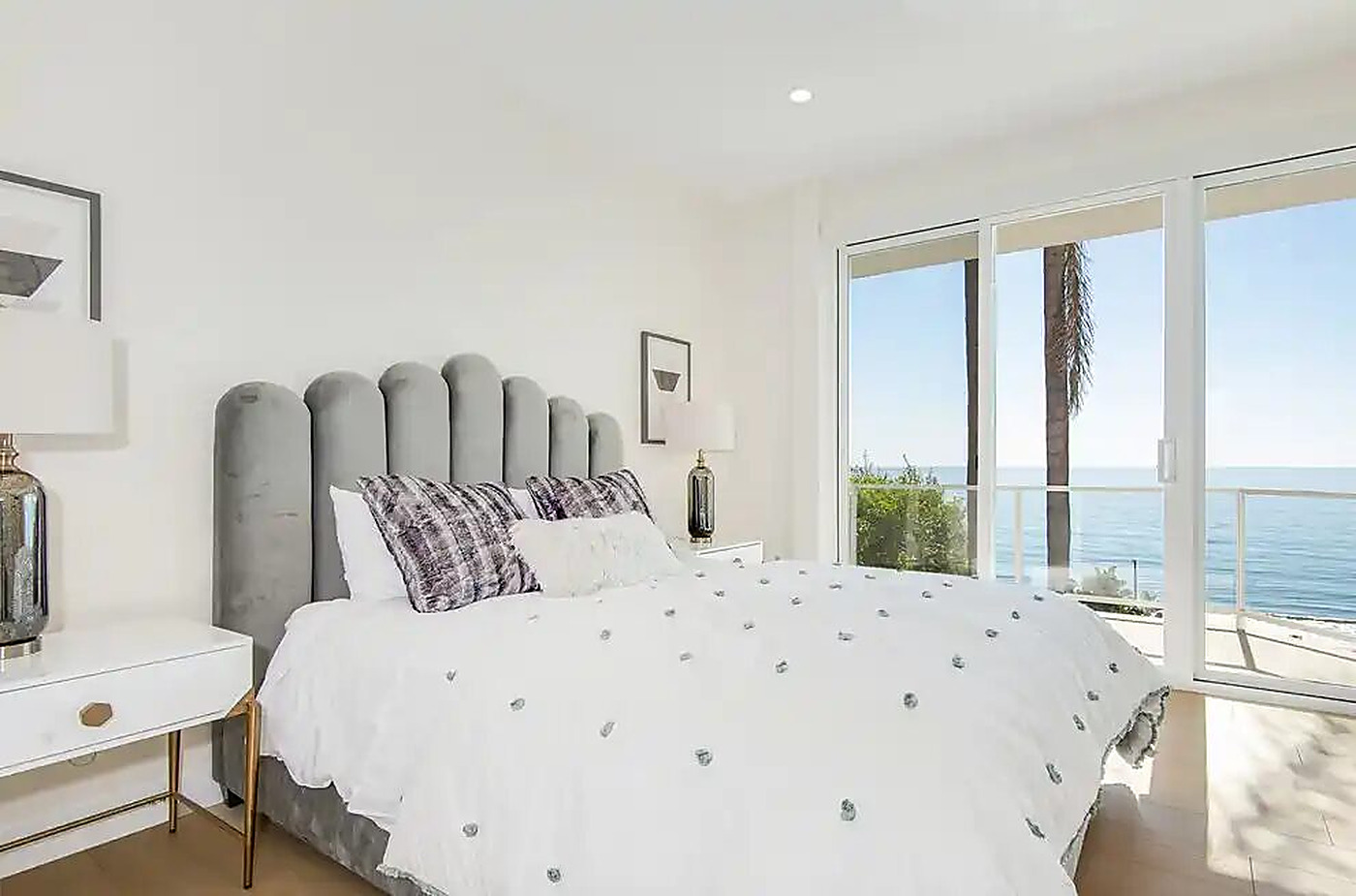 Primary bedroom suite opening to an ocean-facing terrace