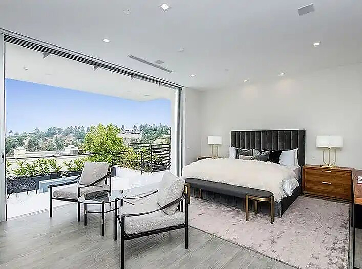 Hotel suite with lounge seating and city view
